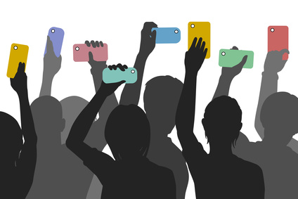 Editable vector silhouettes of people holding up smartphones to record an incident
